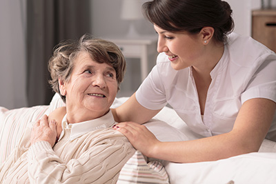 Nurse caring for elderly patient
